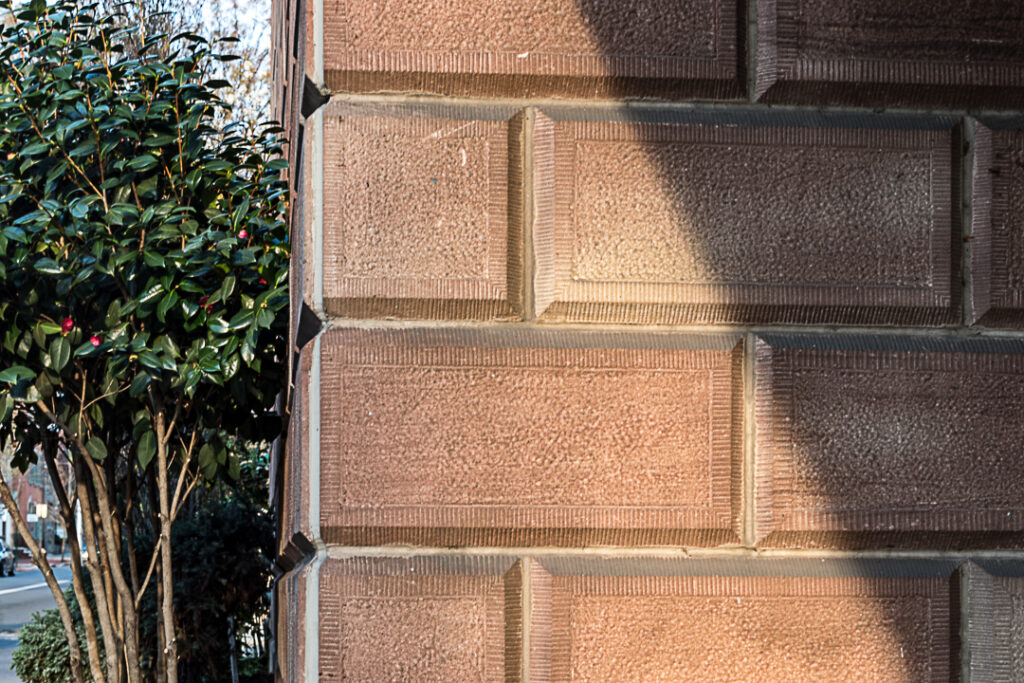 Diagonal shadow on a stone wall