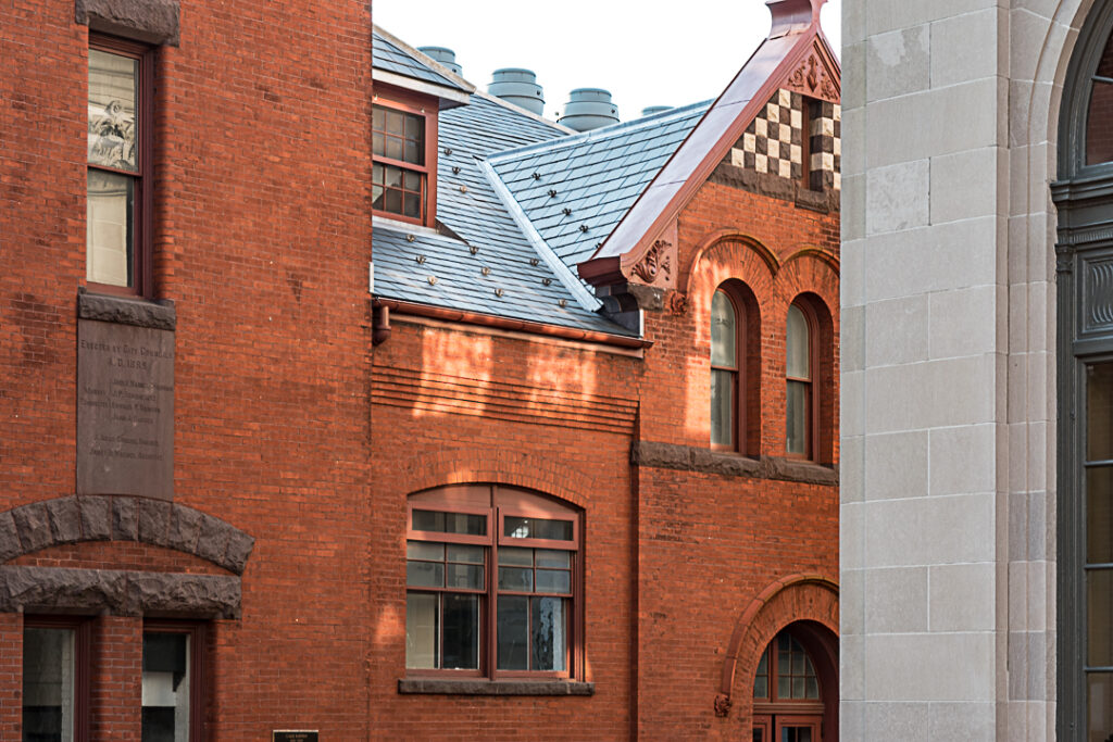 Patches of sunshine on brick market building.