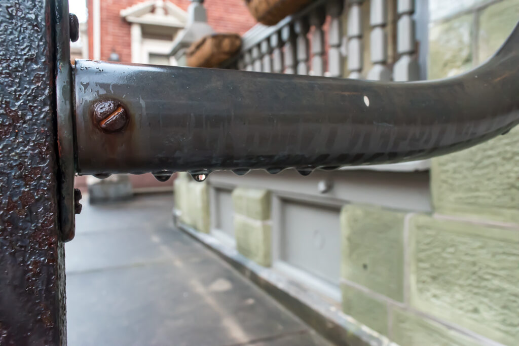 Raindrops on a porch railing